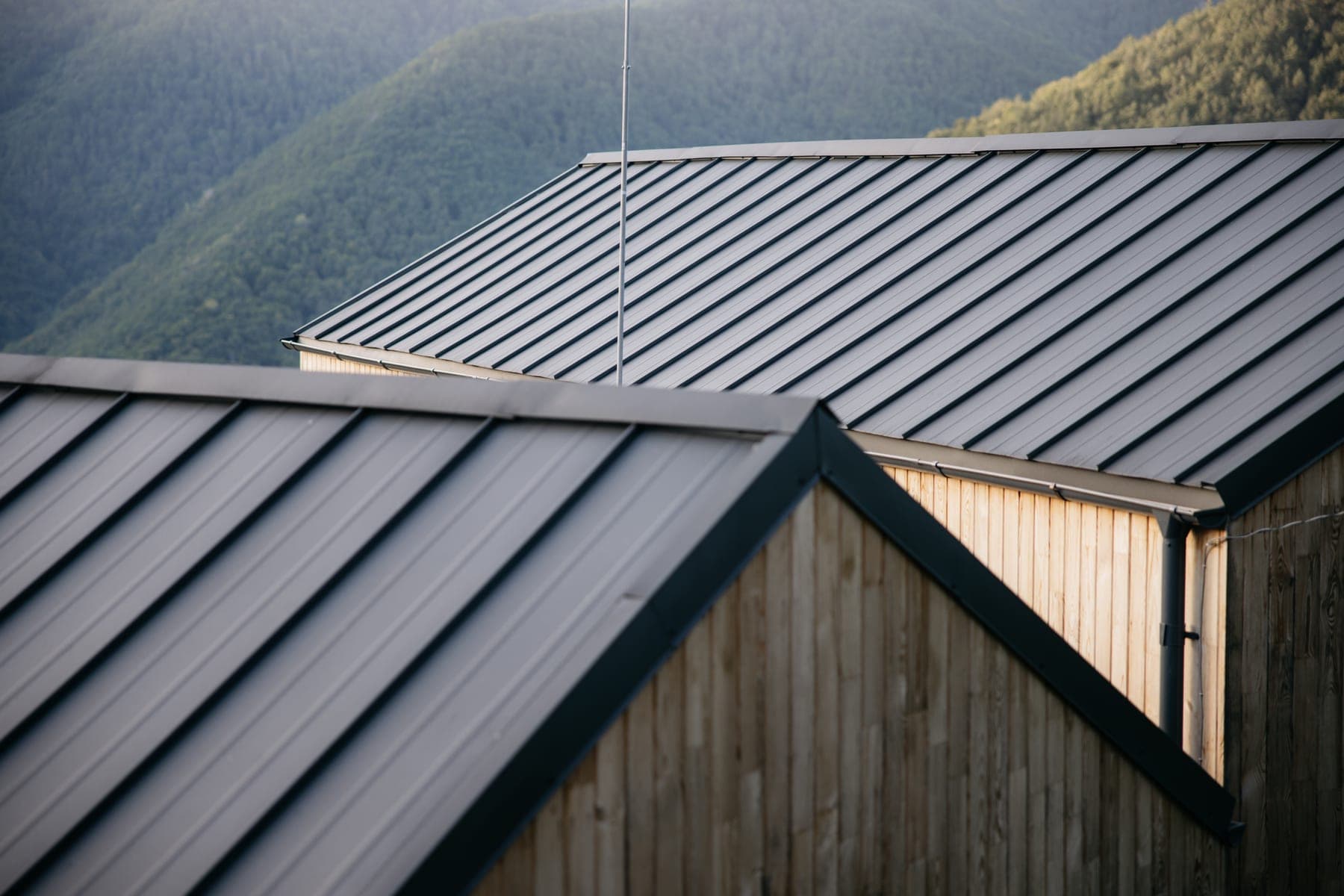 Completed standing seam metal roof on a house